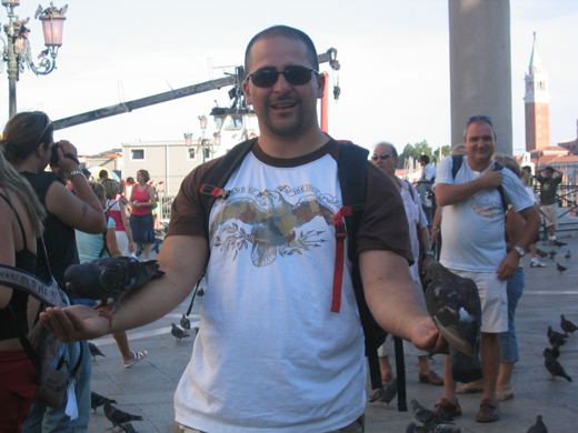 Dave feeding the flying rats in Europe
